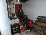 Father and son preparing 2 chickens in the new kitchen