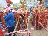 Here the sedan chairs are put down and people pray to them